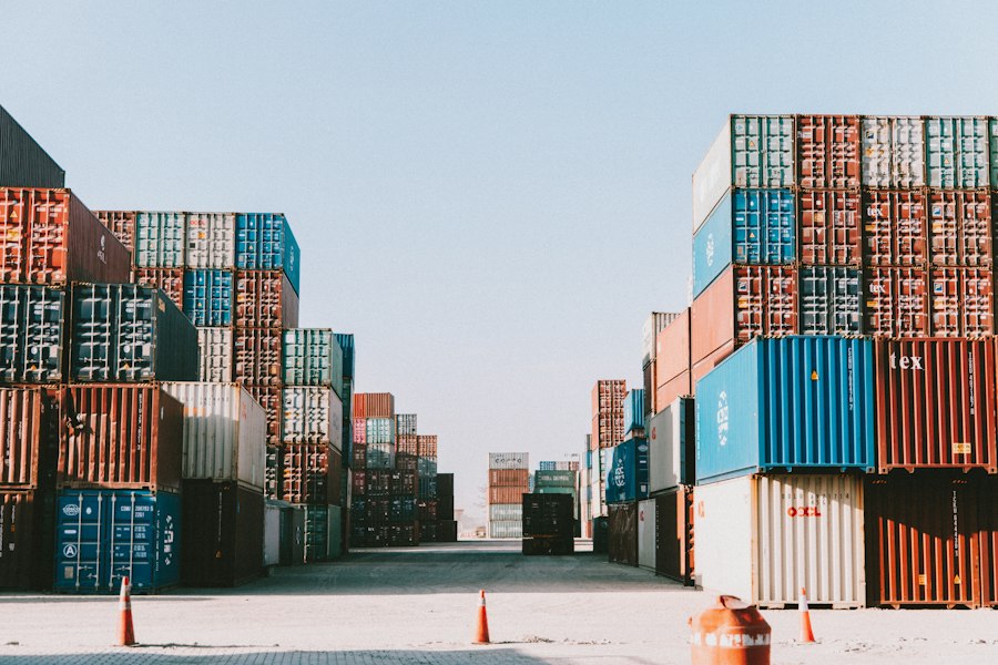 Stacked shipping containers in a logistics yard